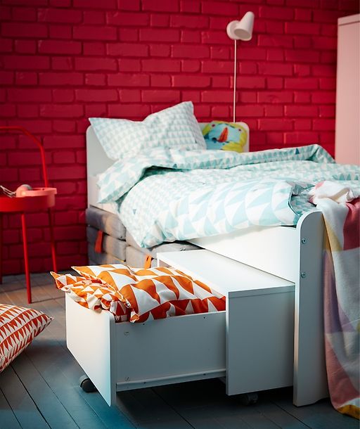 IKEA SLÄKT white bed and kid's storage unit are a small space