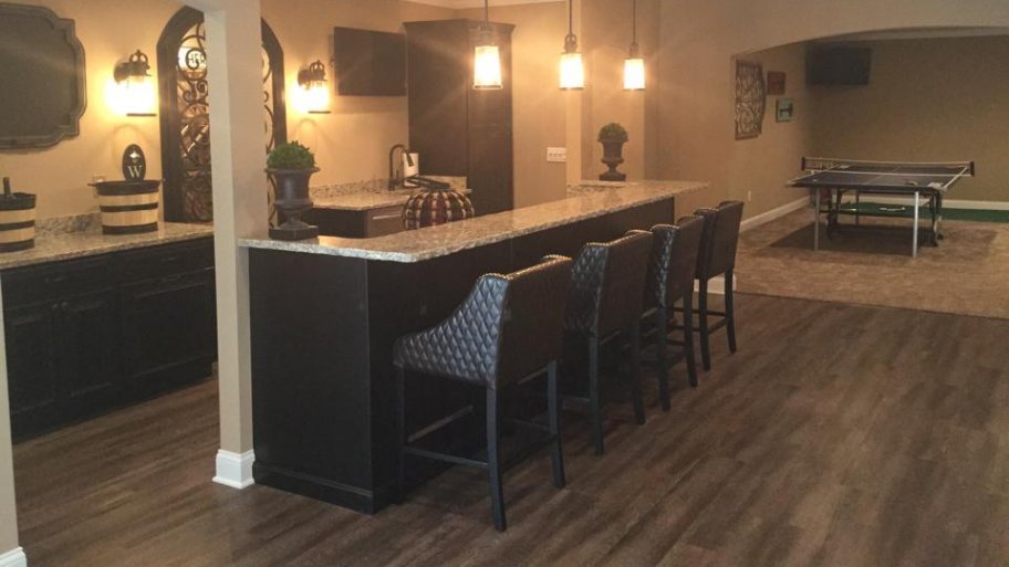 Laminate is just one of several good basement flooring options you can  choose for your remodeling project. (Photo courtesy of Joe Zago)