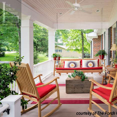 colorful cushions on beautiful front porch with porch swing