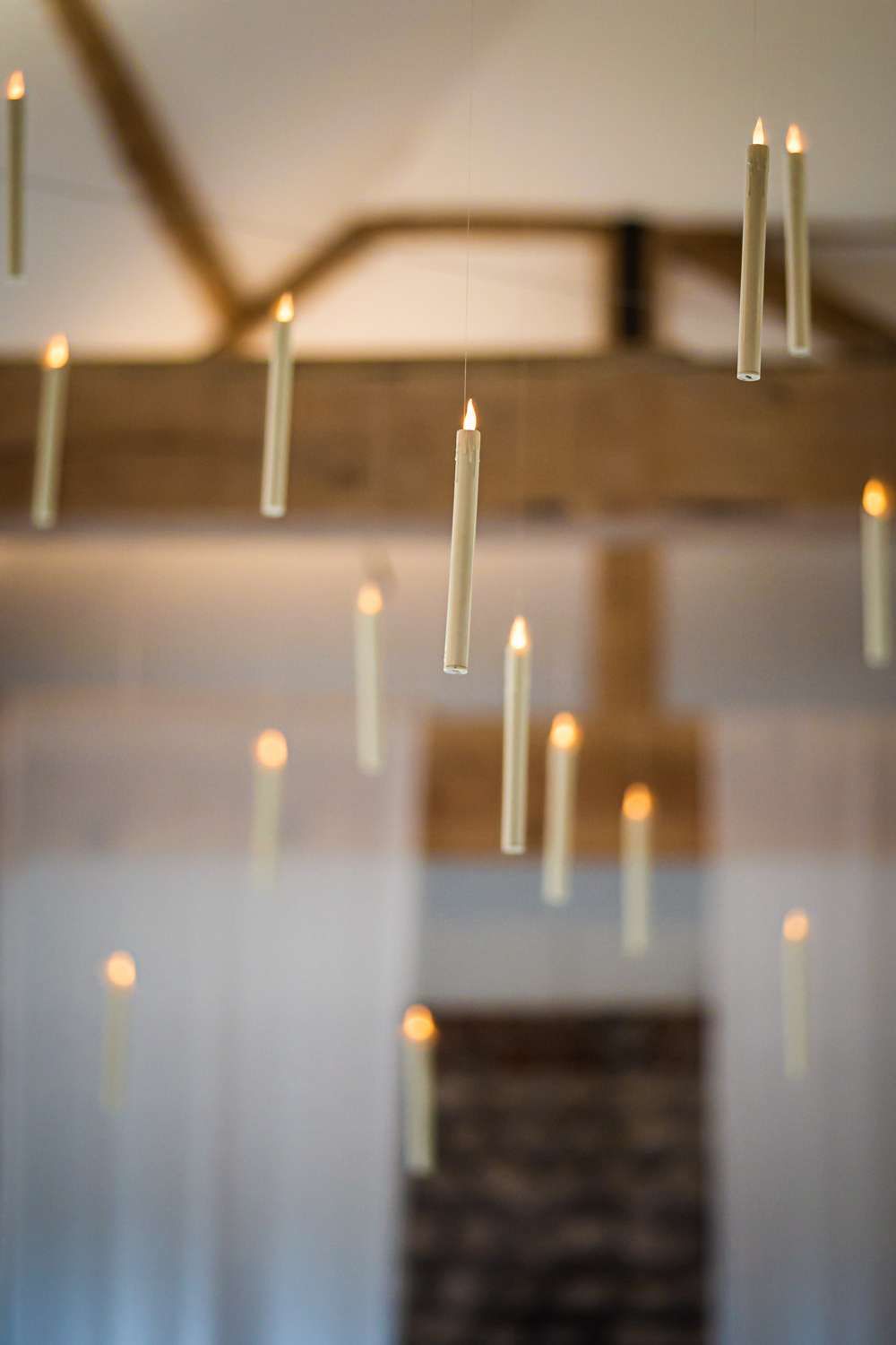 3 candles hanging at the window sill