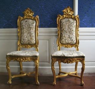 two antique gold chairs