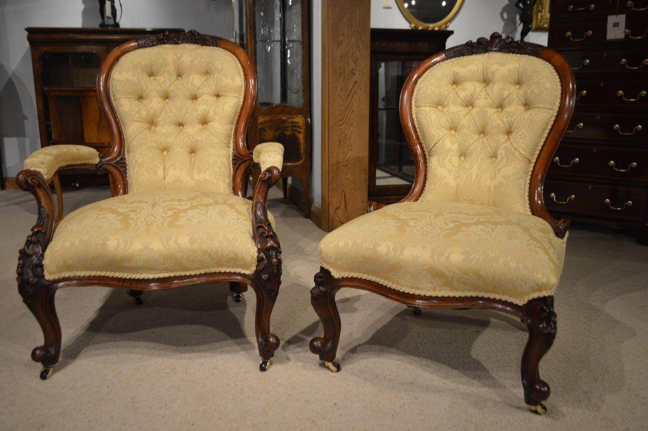 A lovely pair of walnut Victorian Period antique chairs. Each having a  shaped deep buttoned