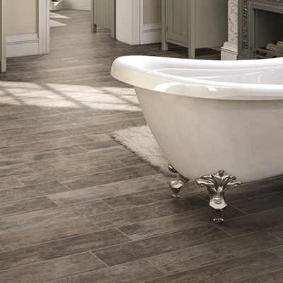 Introduce a natural element to your bath with resilient, water-resistant  wood or stone look porcelain tile. Tiled floors