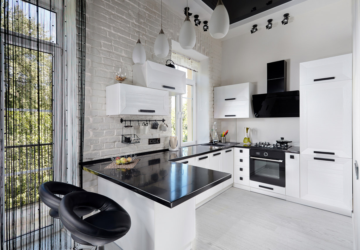 Modern black and white kitchen. I think the little bit of black is just  perfect