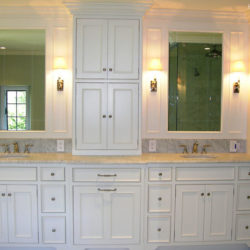 White Bathroom Cabinetry with two sinks create a double vanity for a  home in Berwyn,