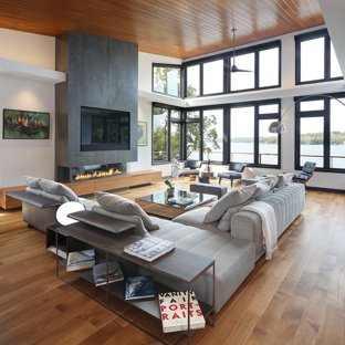 Example of a trendy open concept medium tone wood floor family room design  in Milwaukee with