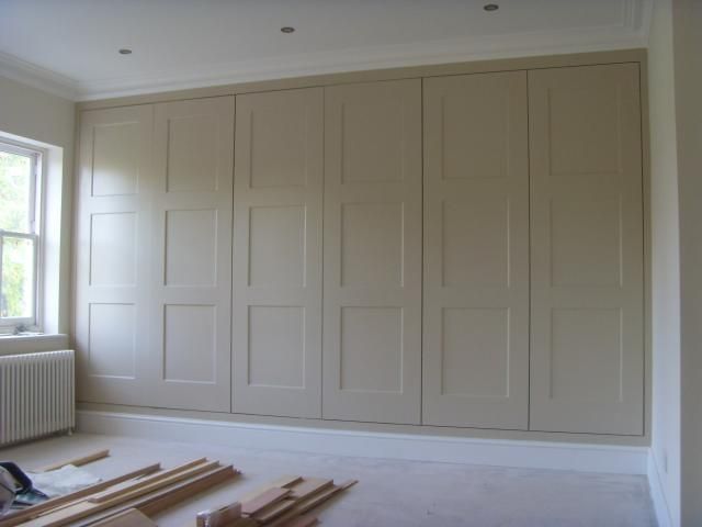Love how these look like old fashioned paneled walls --- Fitted wardrobes  Kingston KT1