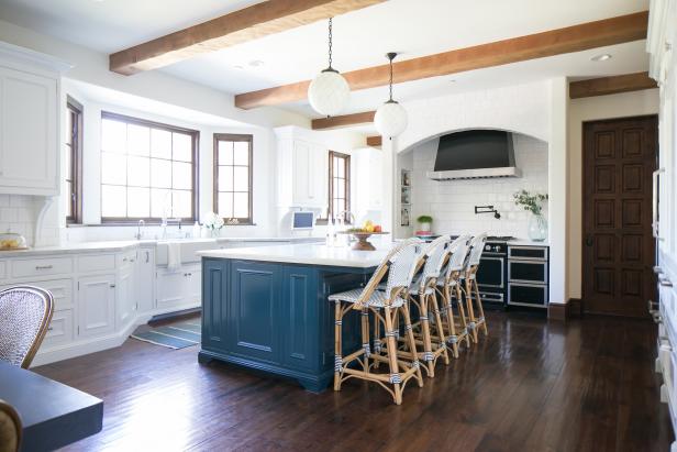 Spacious Transitional Kitchen With Blue Island, Globe Pendant Lights  Between Exposed Beams and