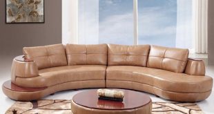 This two-piece curved leather sectional features a rounded edge shape with  rich wood plating on the top and small side platform.