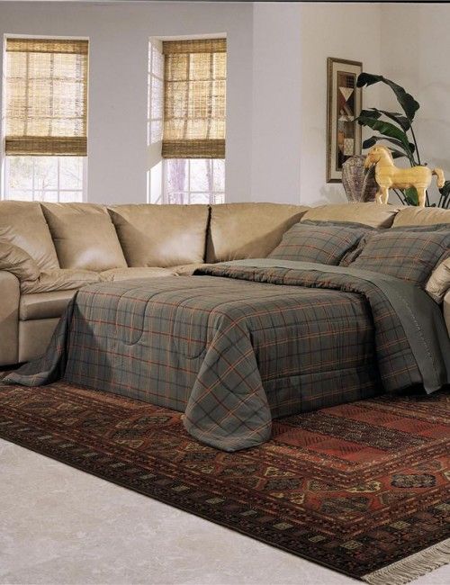Reclining sectional sofa with sleeper
