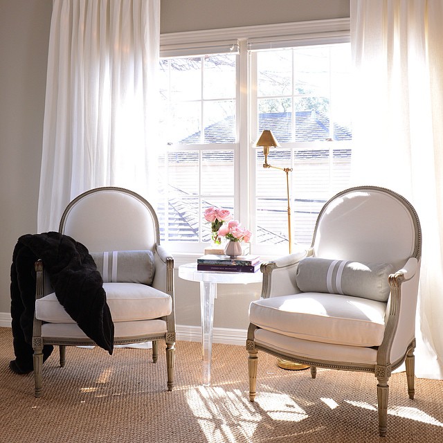 Bedroom Sitting Area with French Chairs and Lucite Table