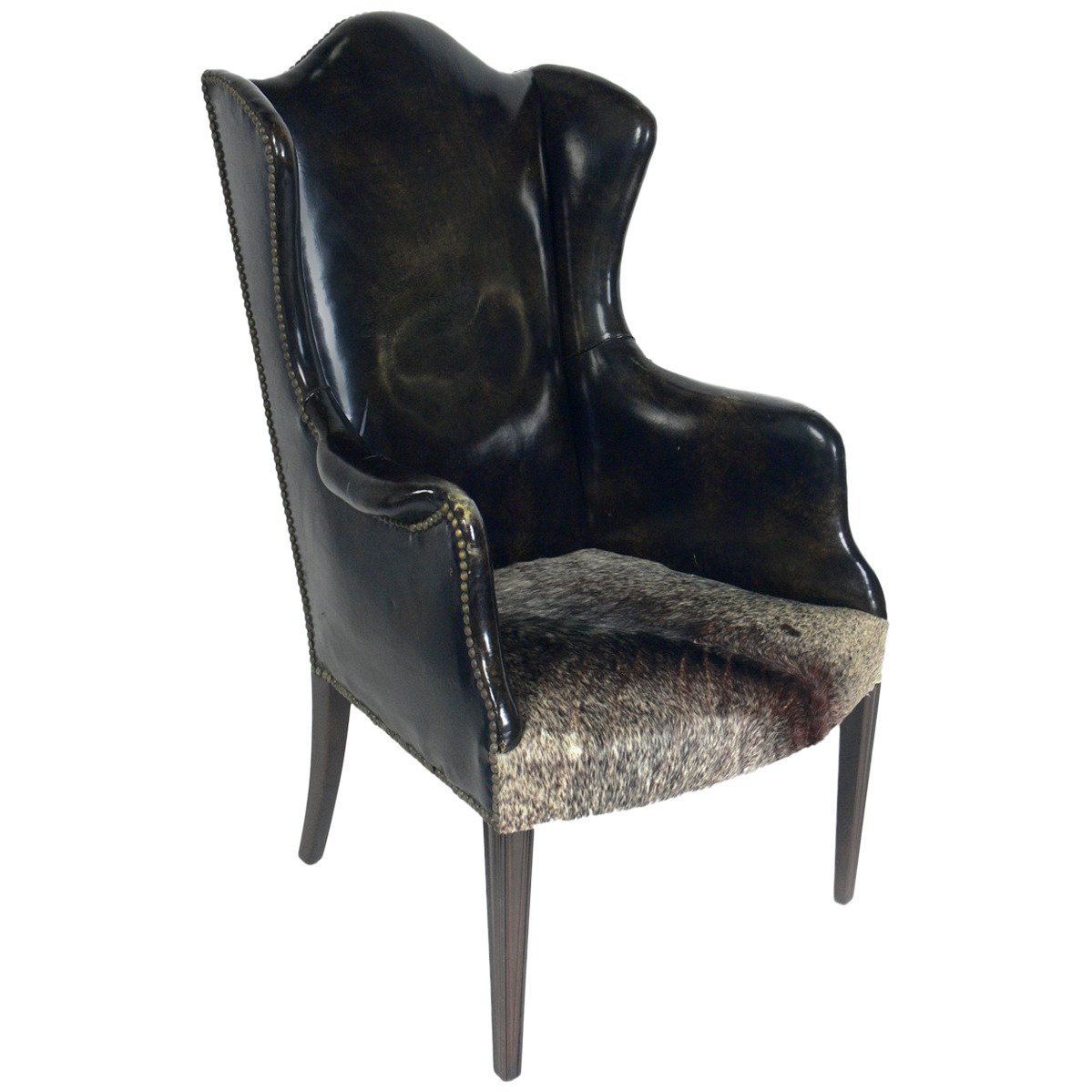Antique Leather and Cowhide Wingback Armchair For Sale