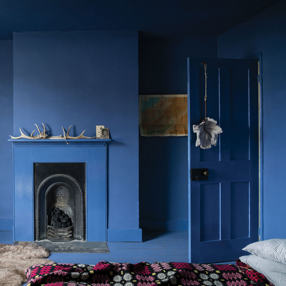 A-bedroom-painted-in-pitch-by-Farrow-ball blue bedroom design ideas to try in your home
