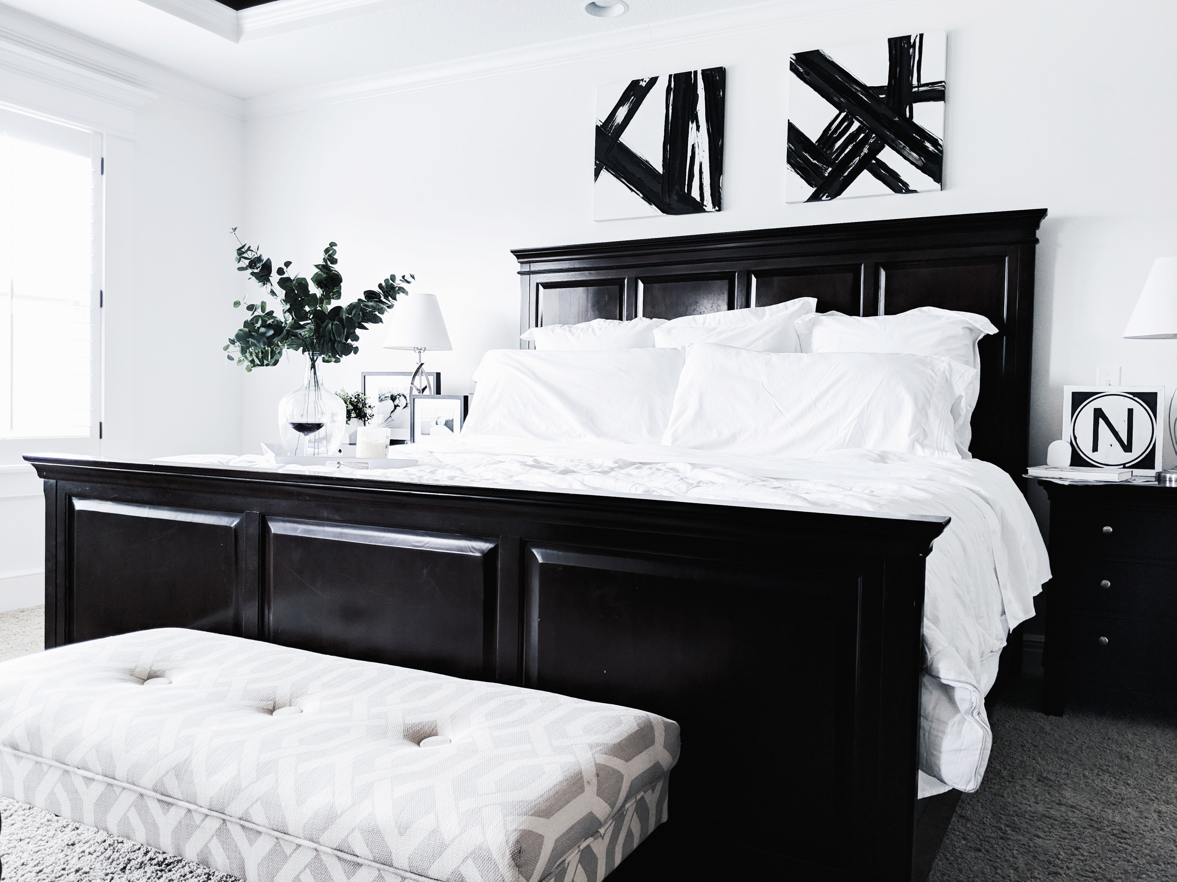 Black and white bedding for a classic bedroom interior