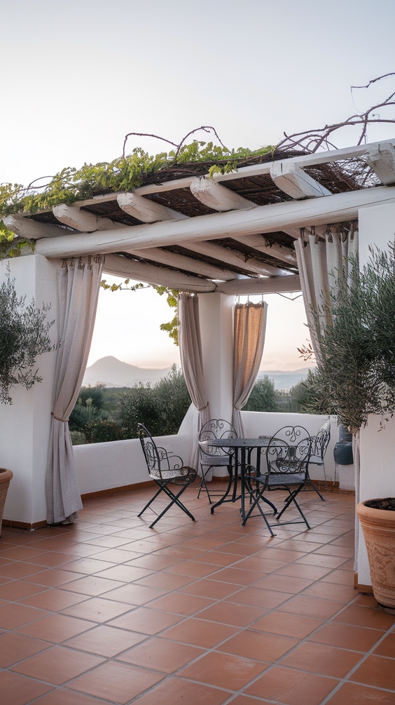 Mediterranean style pergola with terracotta tiles and olive trees
