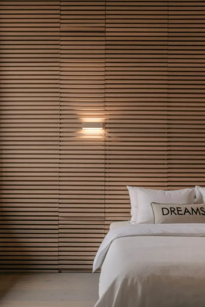 11 Modern Bedroom Back Wall Design Ideas to Transform Your Space 3 Warm Wooden Slat Accent Wall