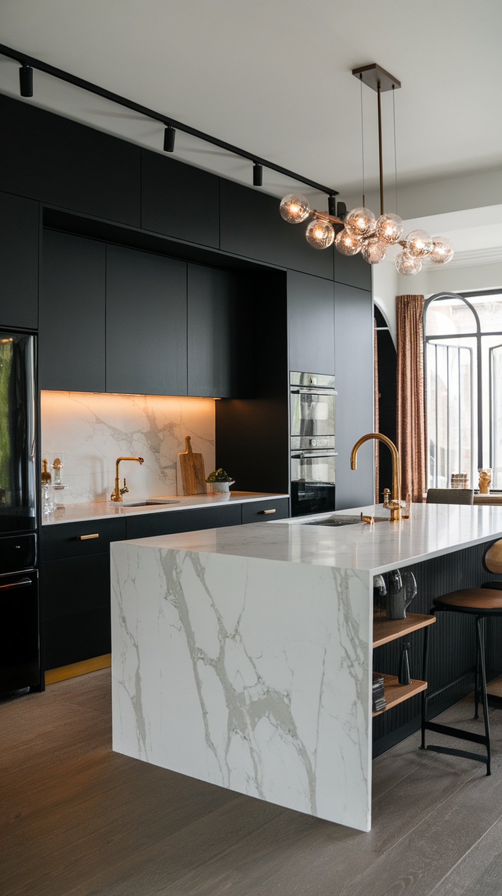 Luxury black kitchen with a marble island and stylish lighting.