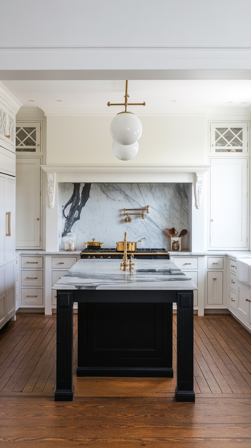 Modern kitchen with black island and white cabinets with marble countertop